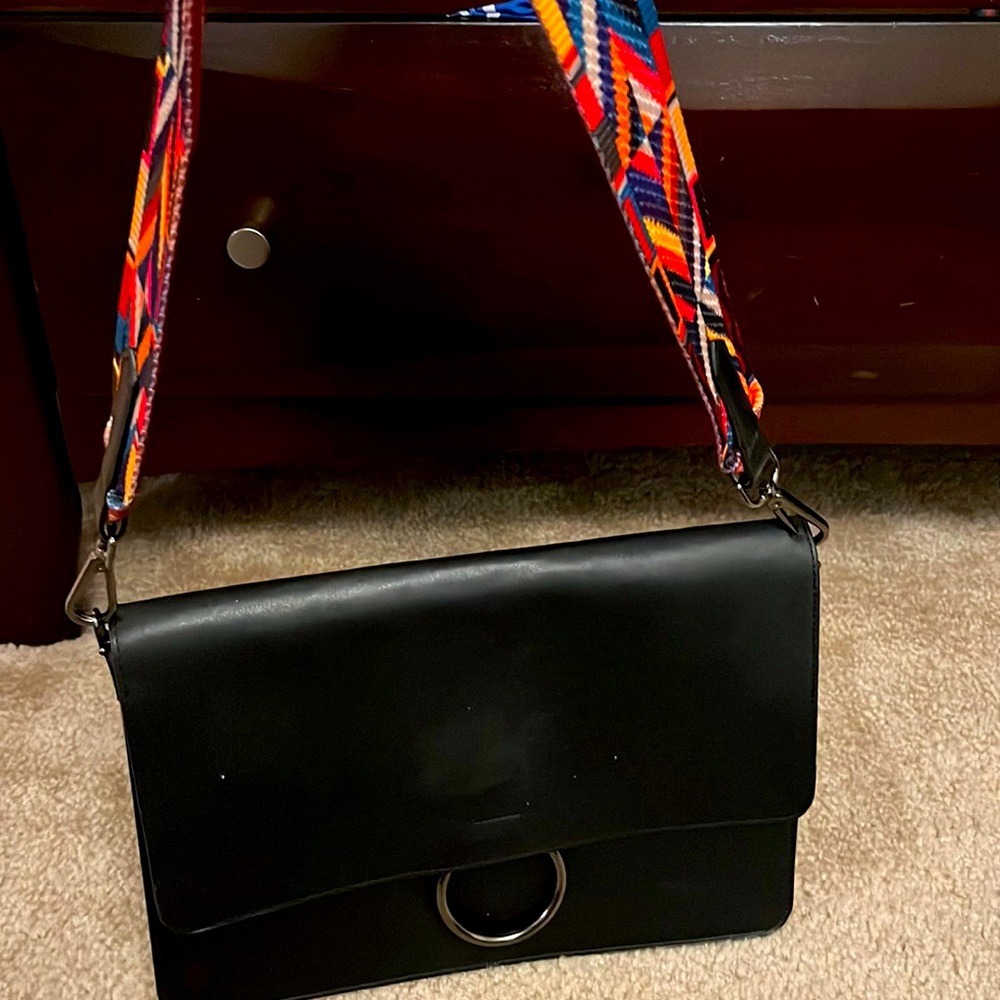 Black shoulder bag with guitar strap